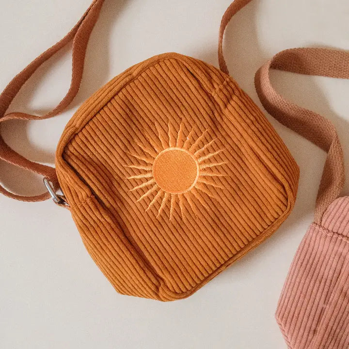 Burnt orange or tan soft corduroy bag with sunshine motif.